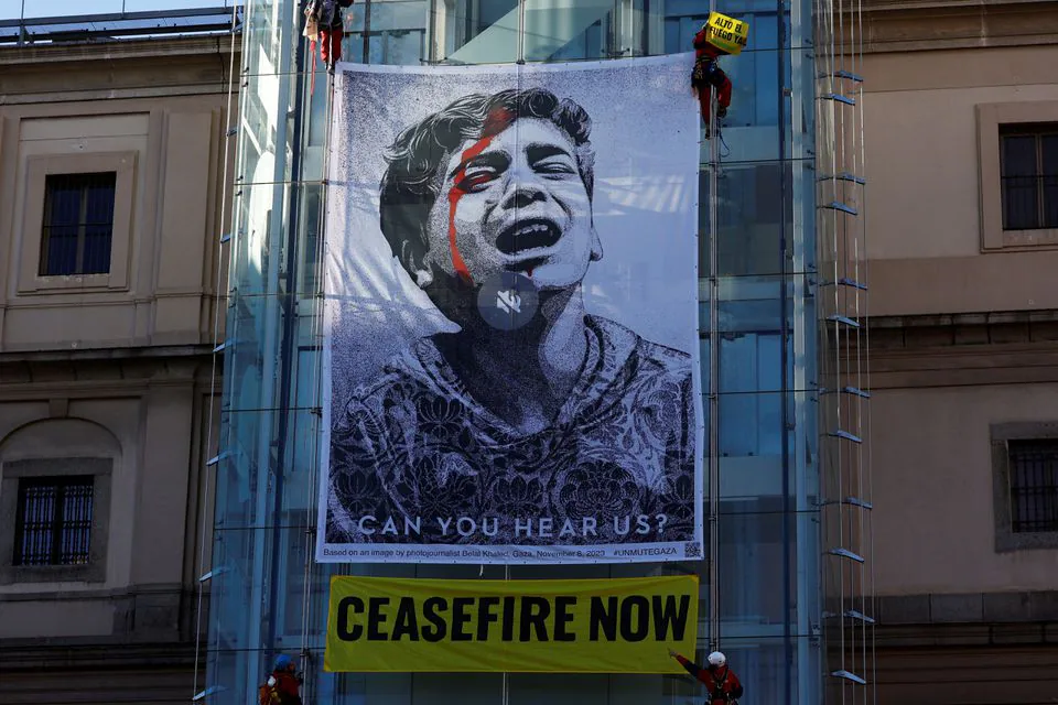 Activists unfurl banner at Madrid museum to demand Gaza ceasefire