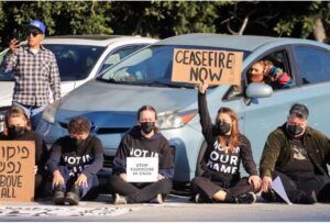 [3/4] Protesters demanding a ceasefire and an end to U.S. support for Israel's attack on Gaza block morning traffic on the 110 Freeway, in Los Angeles, California, U.S., December 13, 2023. REUTERS/David Swanson/File Photo Acquire Licensing Rights