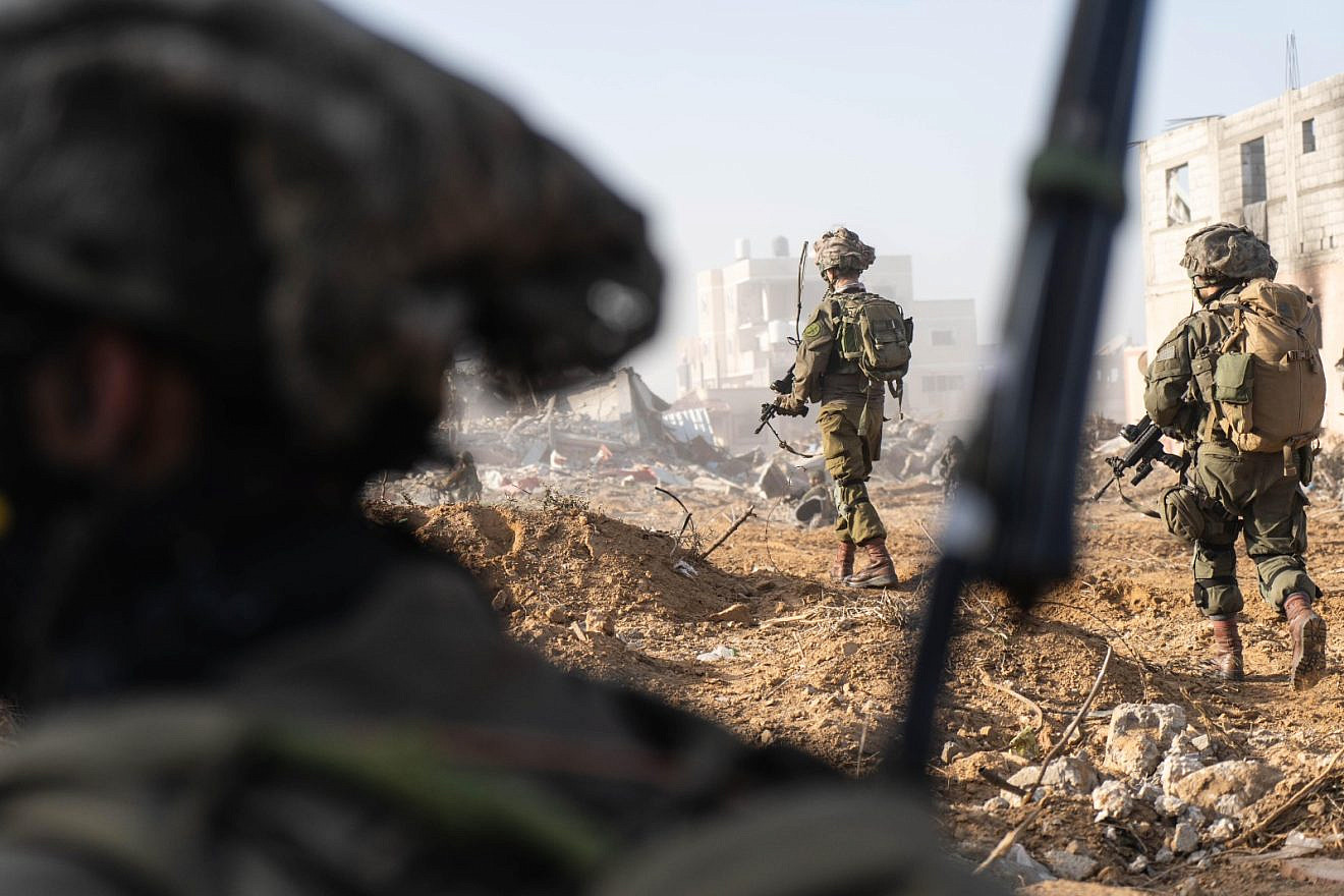 Israeli forces charge back into Gaza City